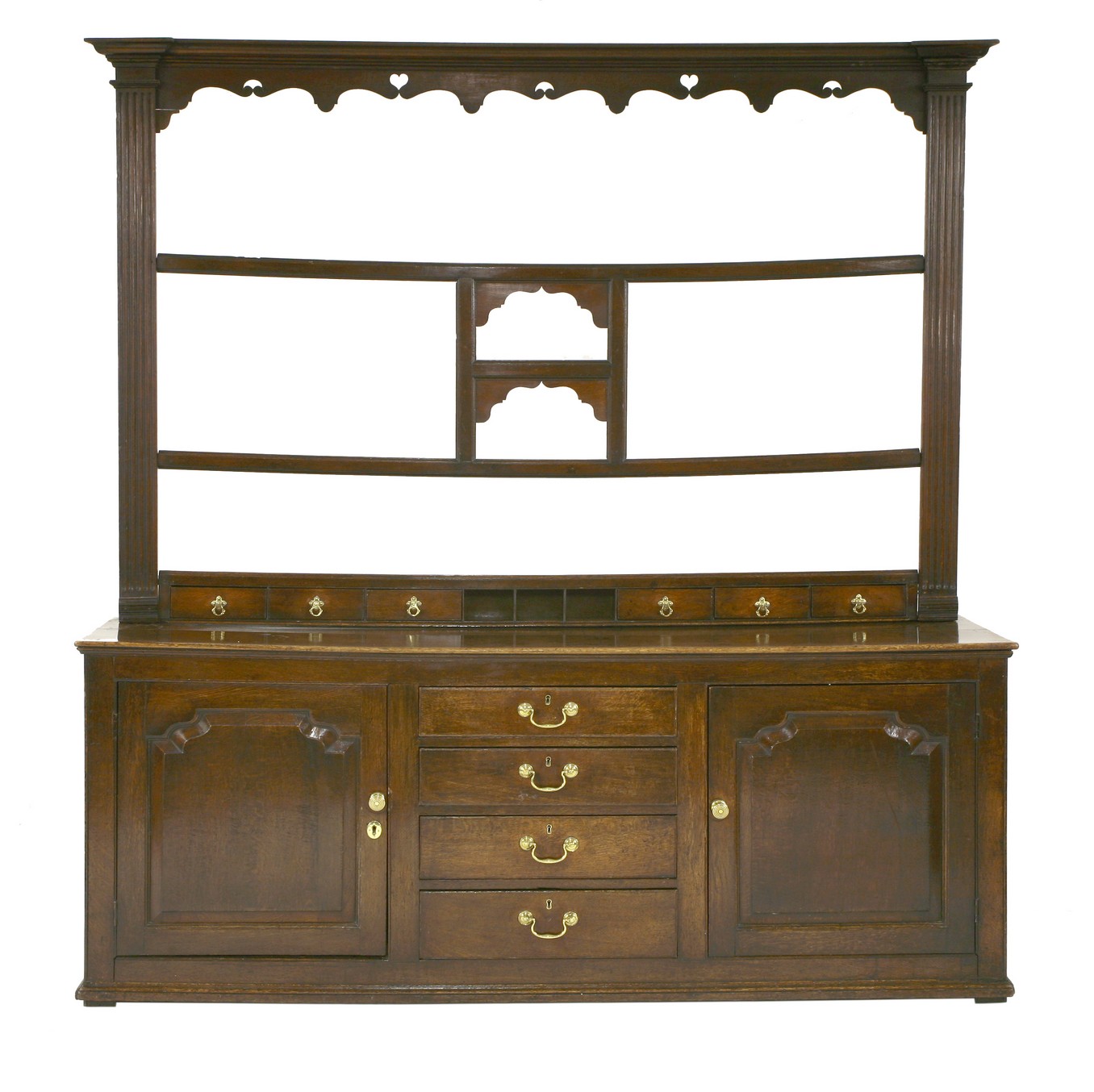 A large Cumbrian oak dresser,
mid 18th century, the open plate rack with three shelves flanked