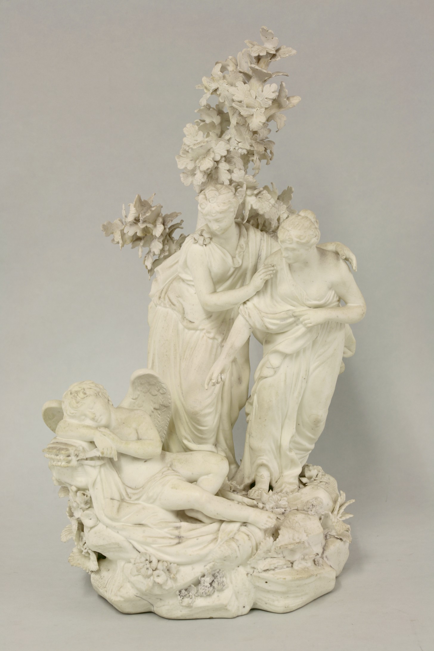 A Derby biscuit porcelain Group,
c.1775, in the form of a pair of classically dressed lovers