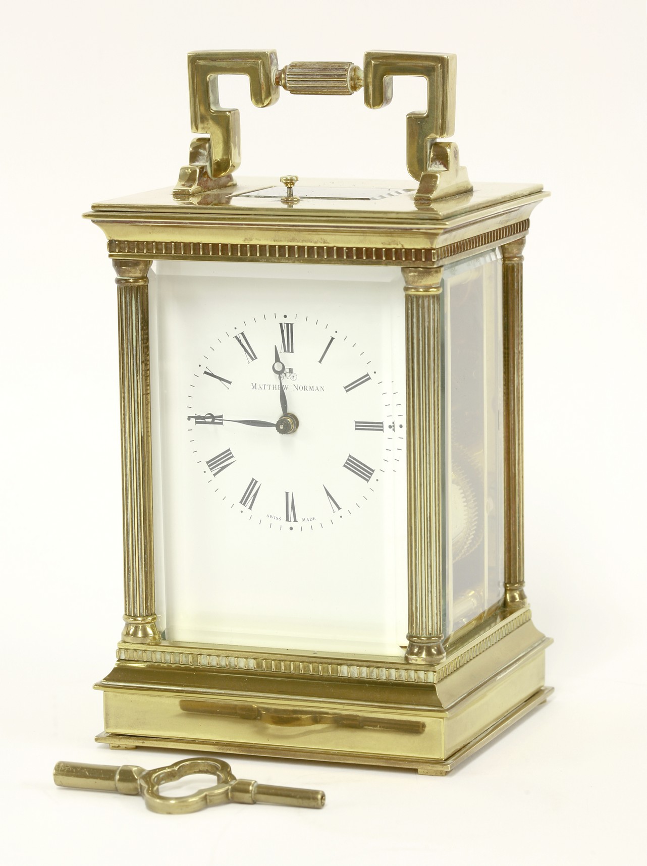 A brass four glass carriage clock, by Matthew Norman, the eight day Swiss movement with repeater