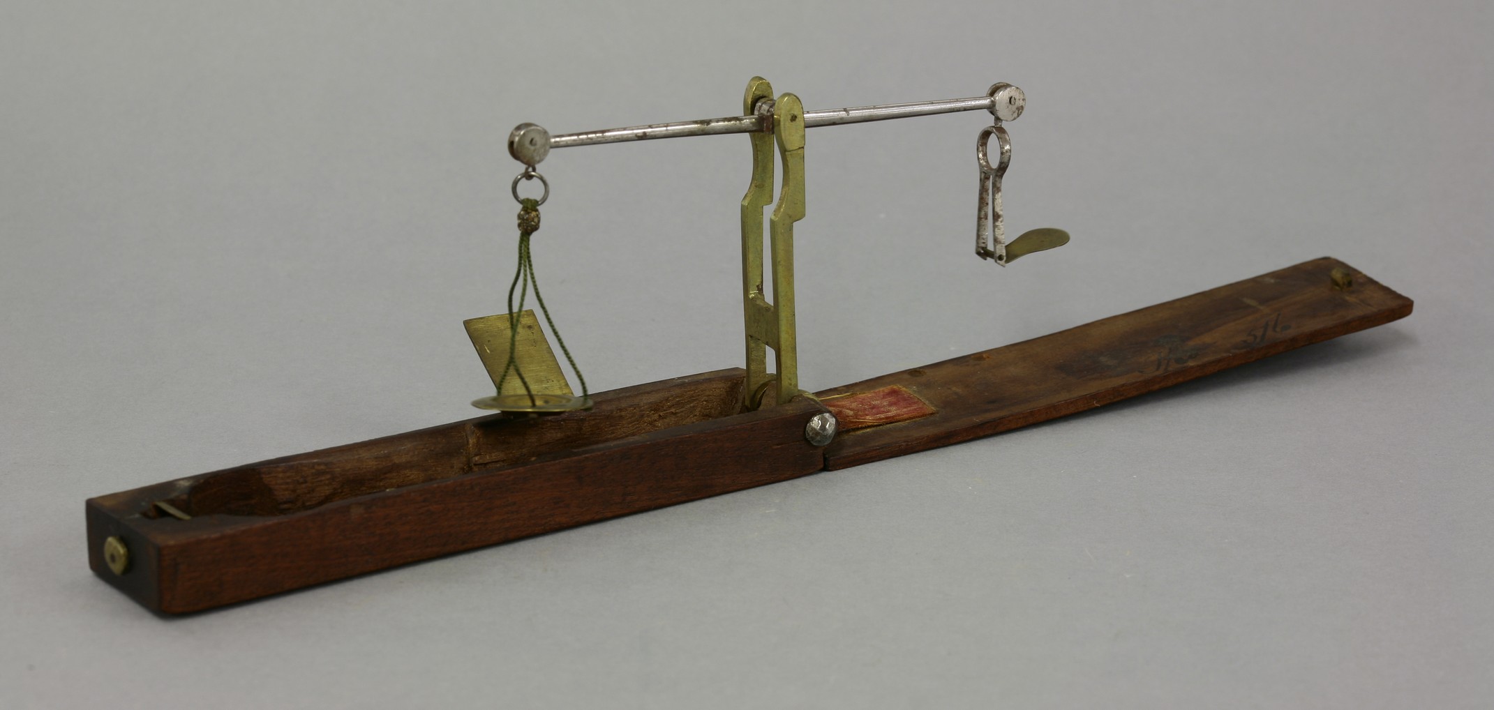 Attributed to Callingwood Ward, a brass and polished steel folding equal arm coin balance, circa