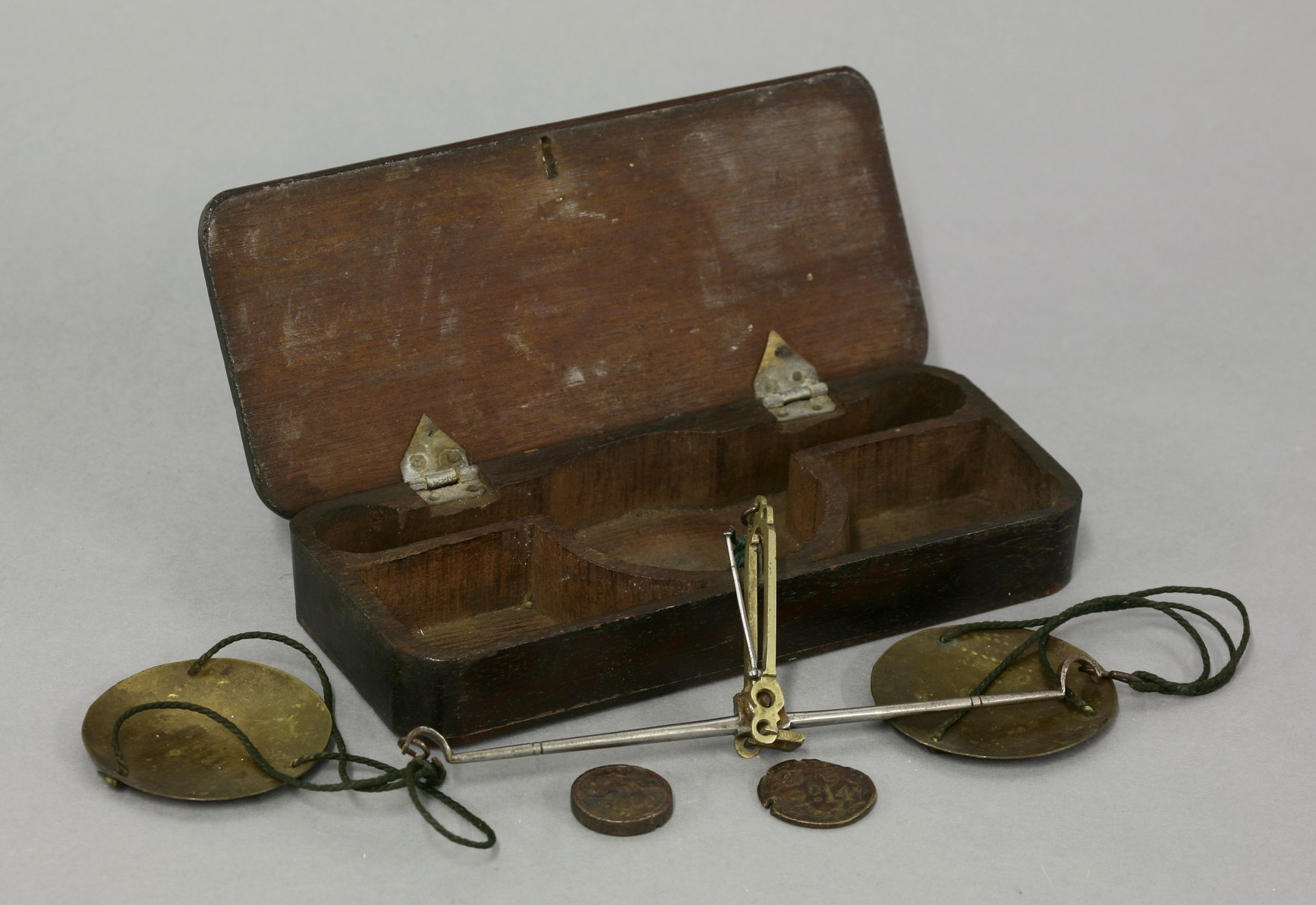 A set of English steel and brass coin scales, the turned beam with swans neck ends with brass