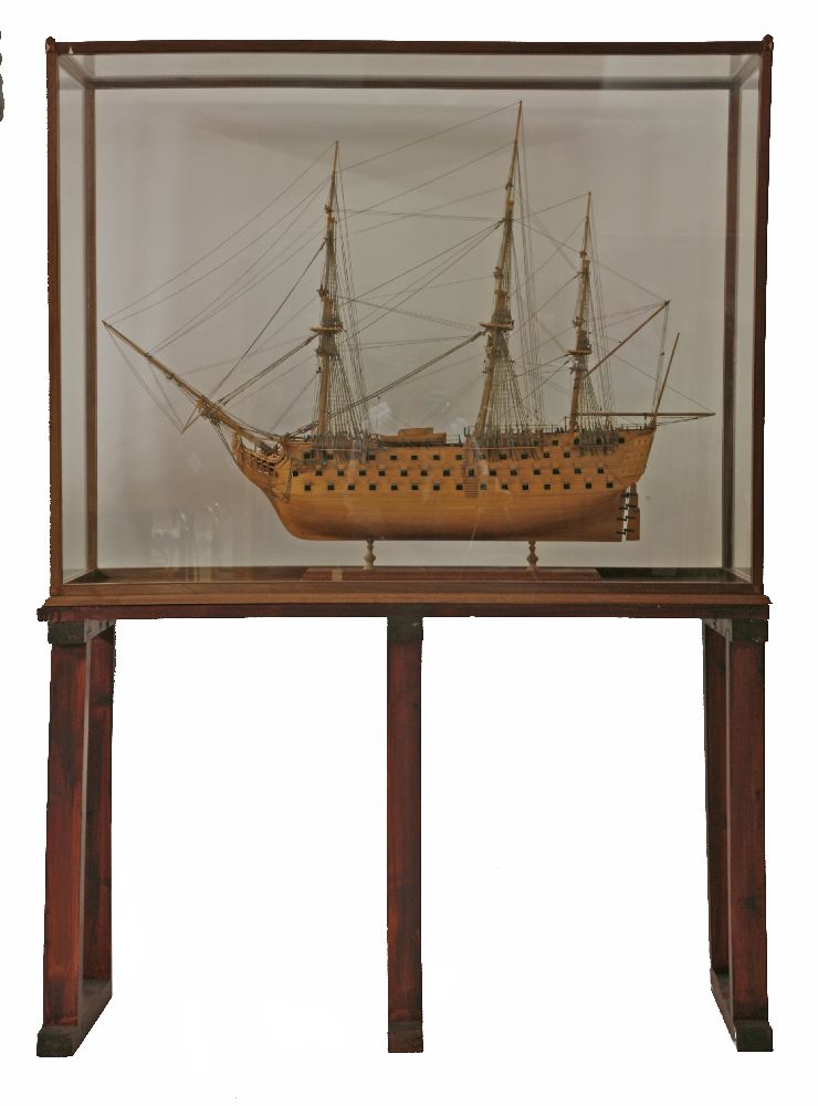 A model of HMS Victory, in a glazed mahogany case, on an associated stained pine stand,136.5cm