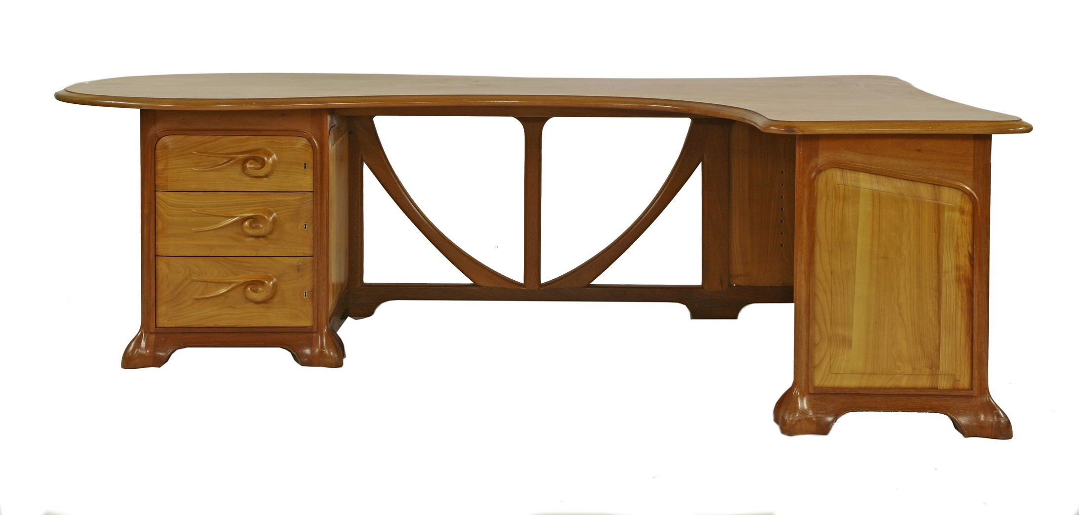 A large Art Nouveau style desk,
by Simon Simpson, Norwich, probably mahogany and sycamore, the