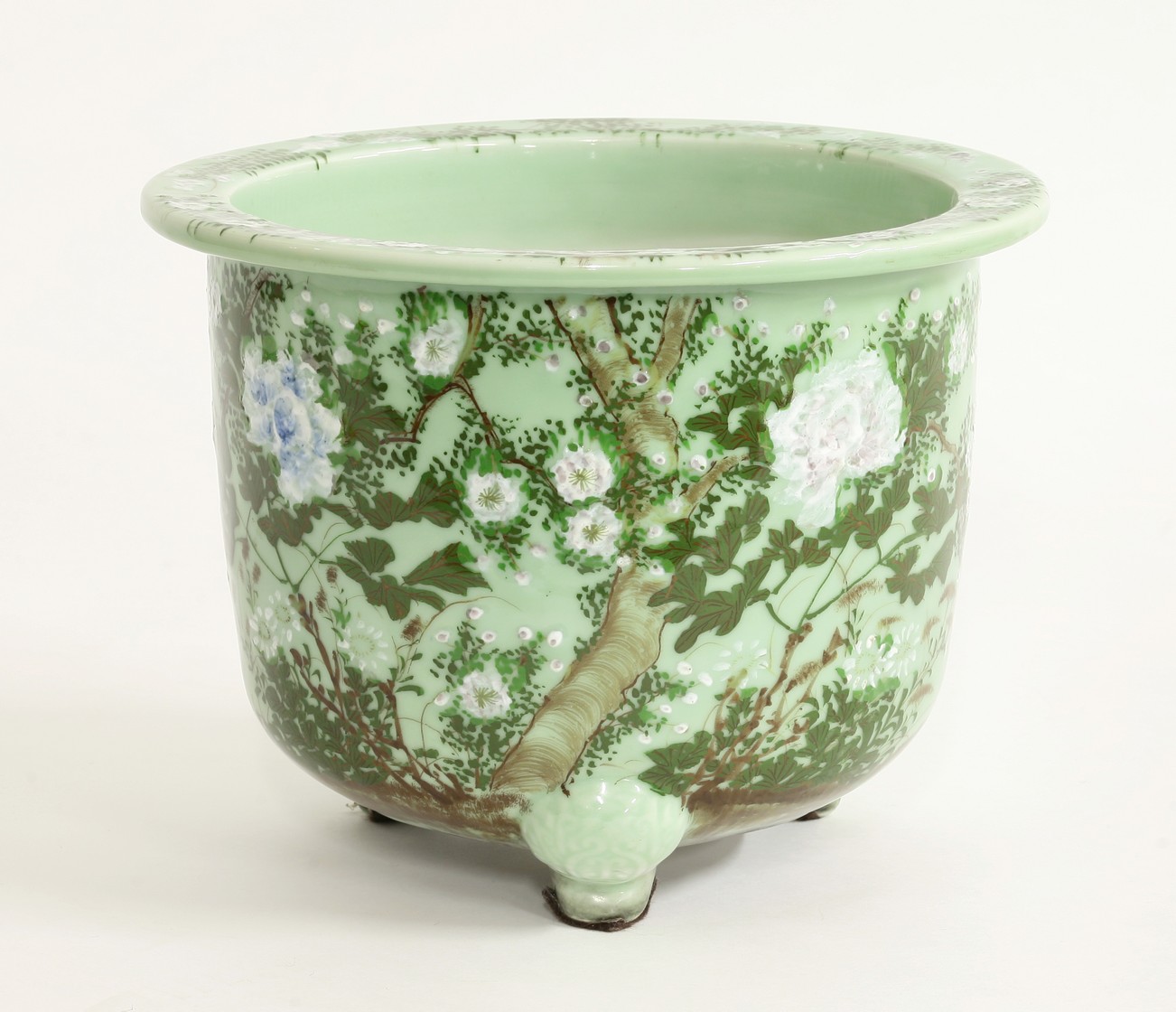 A large pea-green Seto Jardinière,
c.1900, the cylindrical sides and flared rim with various