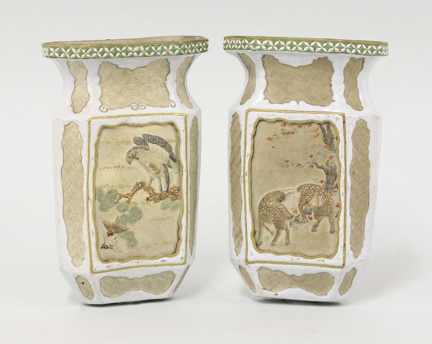 An unusual pair of Banko ware Wall Pockets,
late 19th century, each moulded with deer or eagle,
