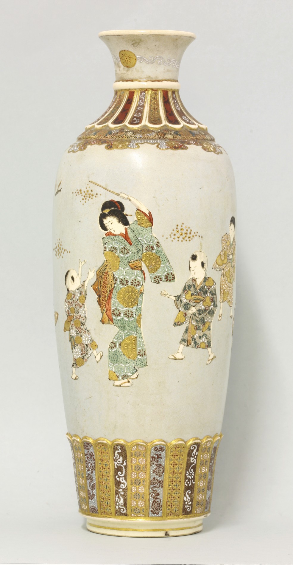 A large 'Satsuma' Vase,
Taisho, the dove-grey rouleau body with women and children, the fluted