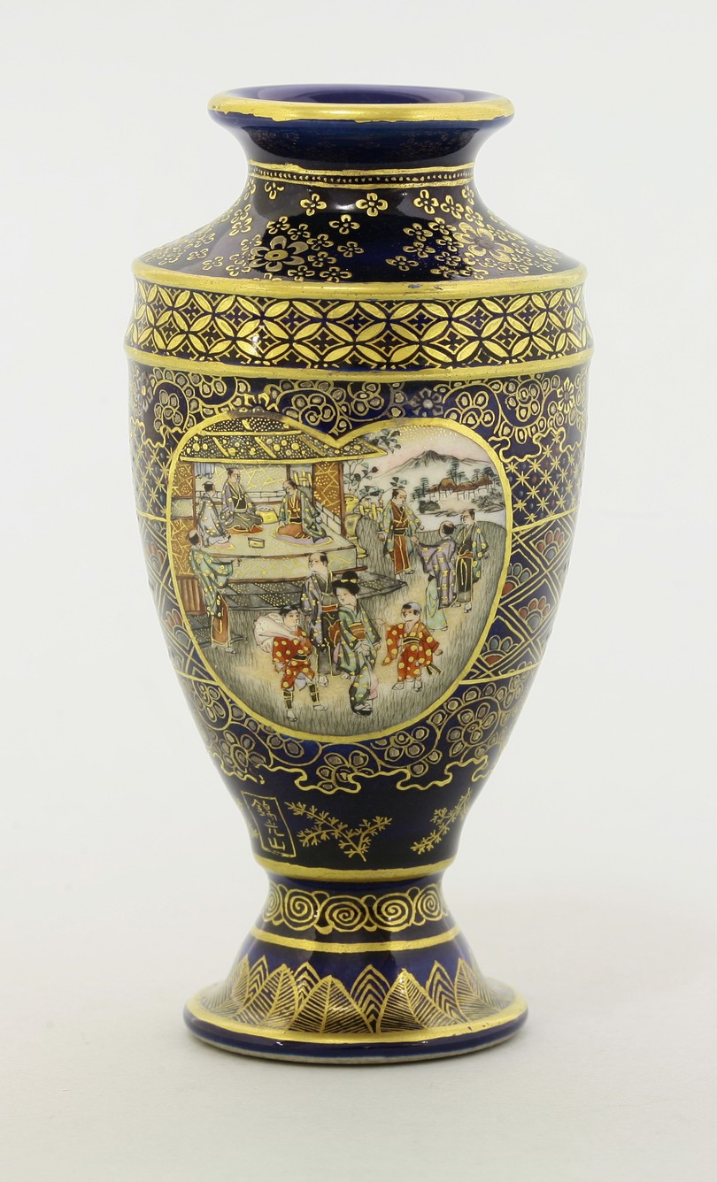 A Kyoto 'Satsuma' Vase,
c.1890, painted with heart-shaped panels of small figures on a hillside or