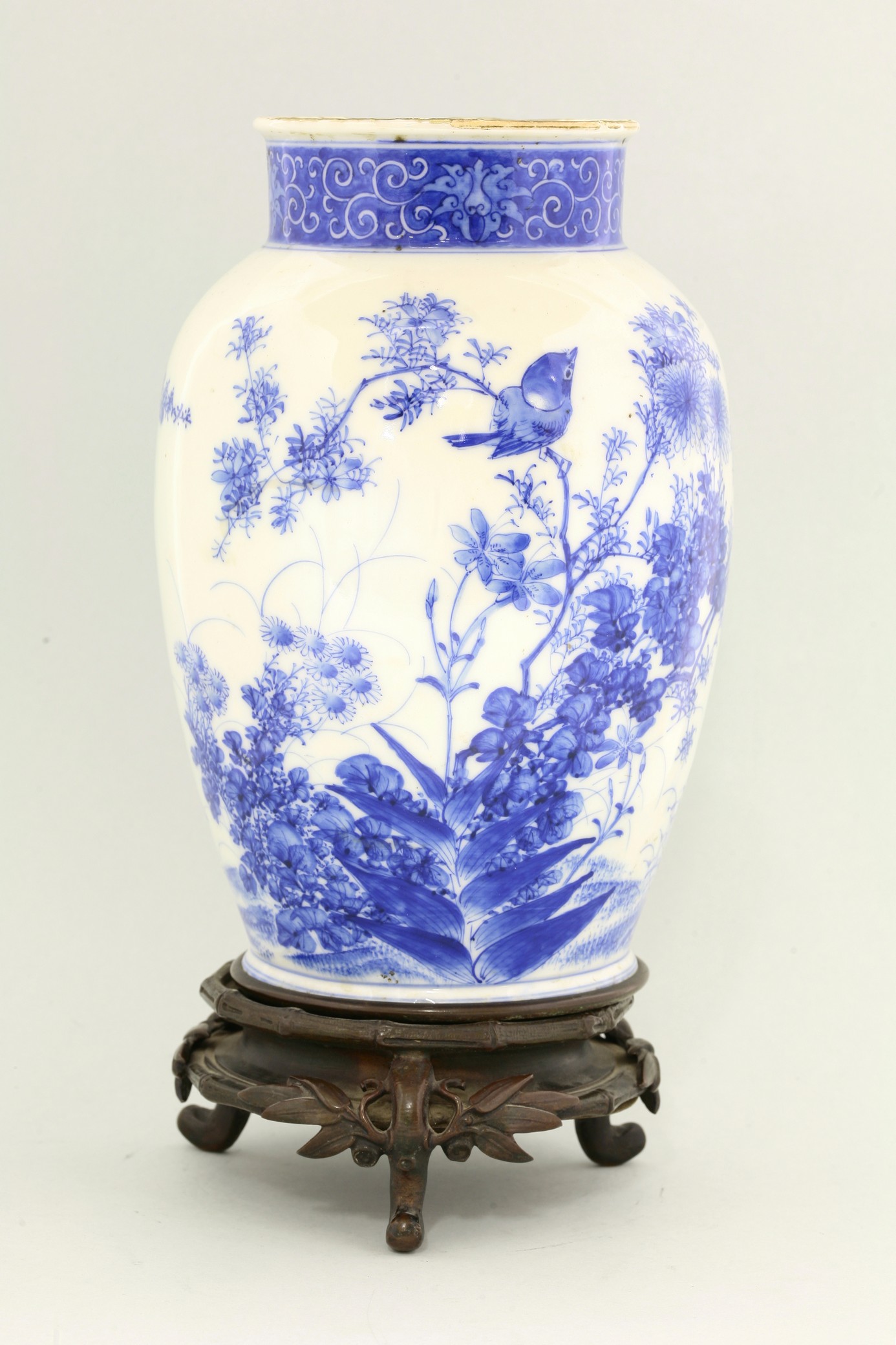 A Seto blue and white Vase,
c.1900, painted with a small bird in chrysanthemums, another flying