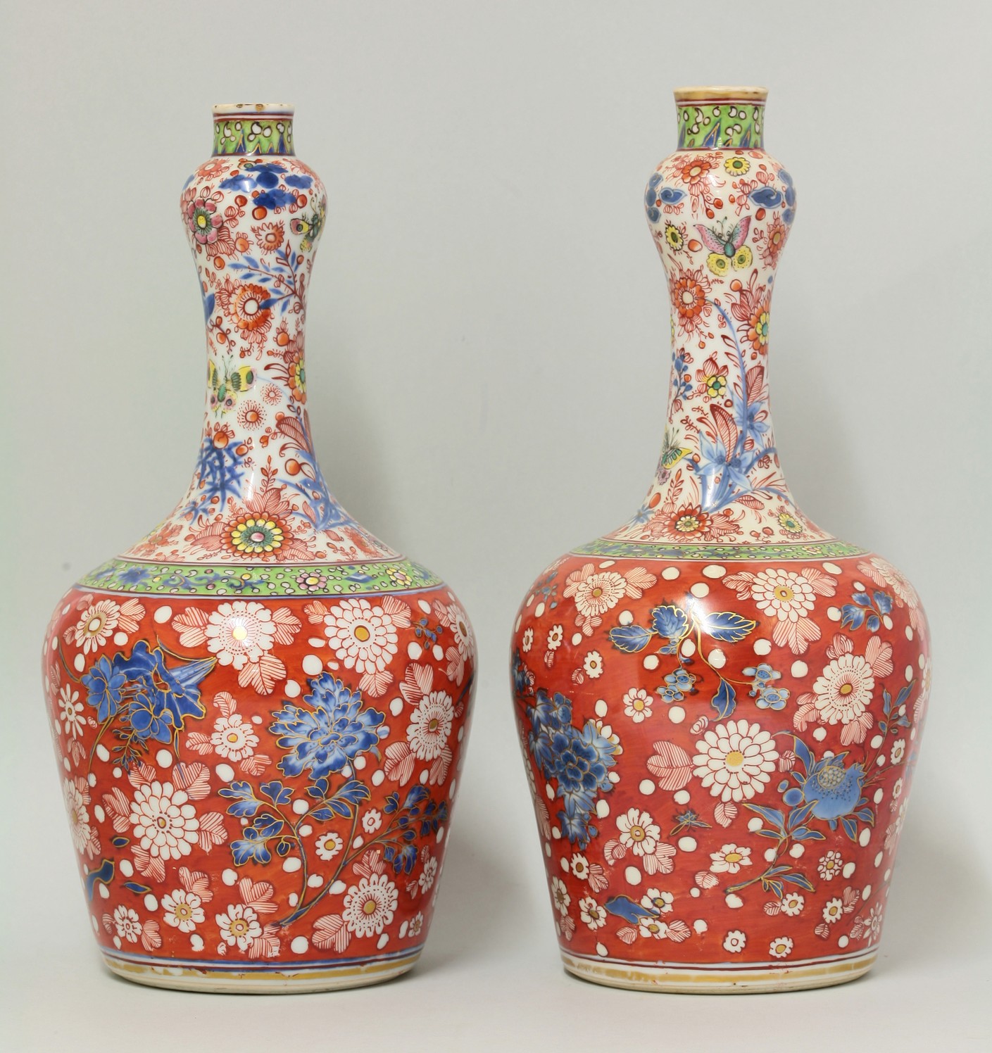 A pair of clobbered mallet-form Vases,
Kangxi and possibly c.1780, the bodies painted with