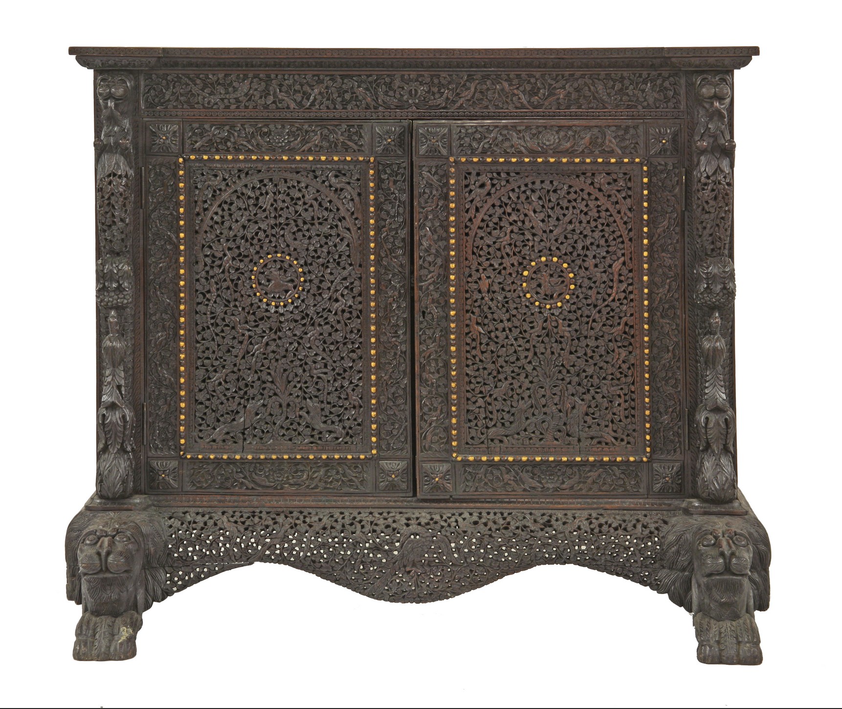 A carved and pierced blackwood Cabinet
c.1890, Bombay, the profusely carved and pierced door