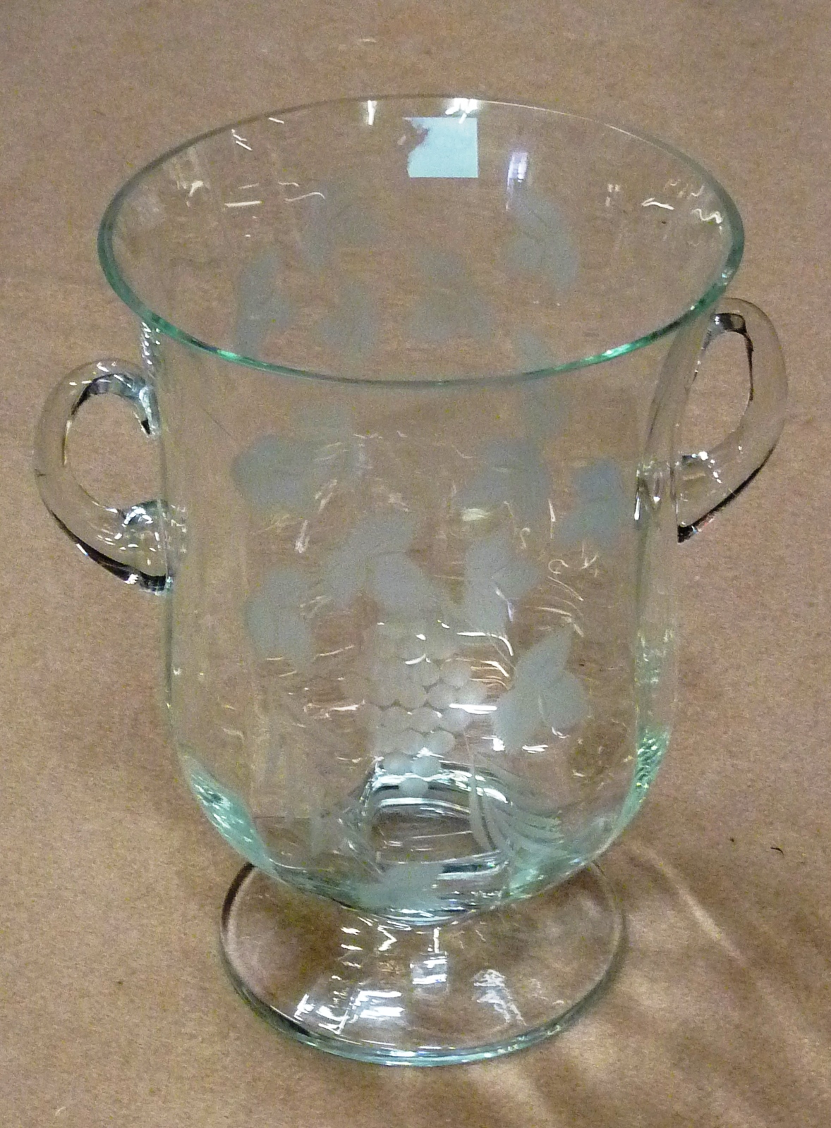 A two handled urn shaped Wine Cooler engraved with fruiting vine, 25cm high