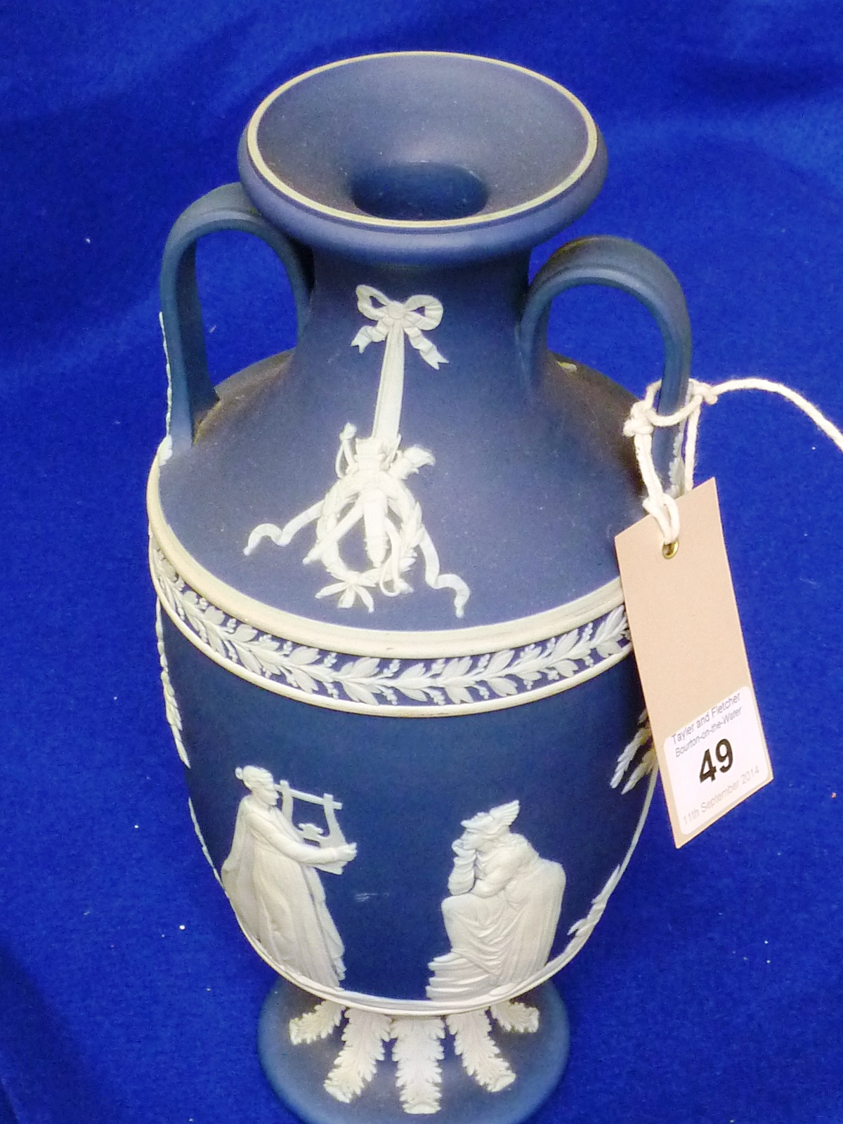 An early 20th Century two handled urn shaped blue Jasperware Vase typically decorated with applied