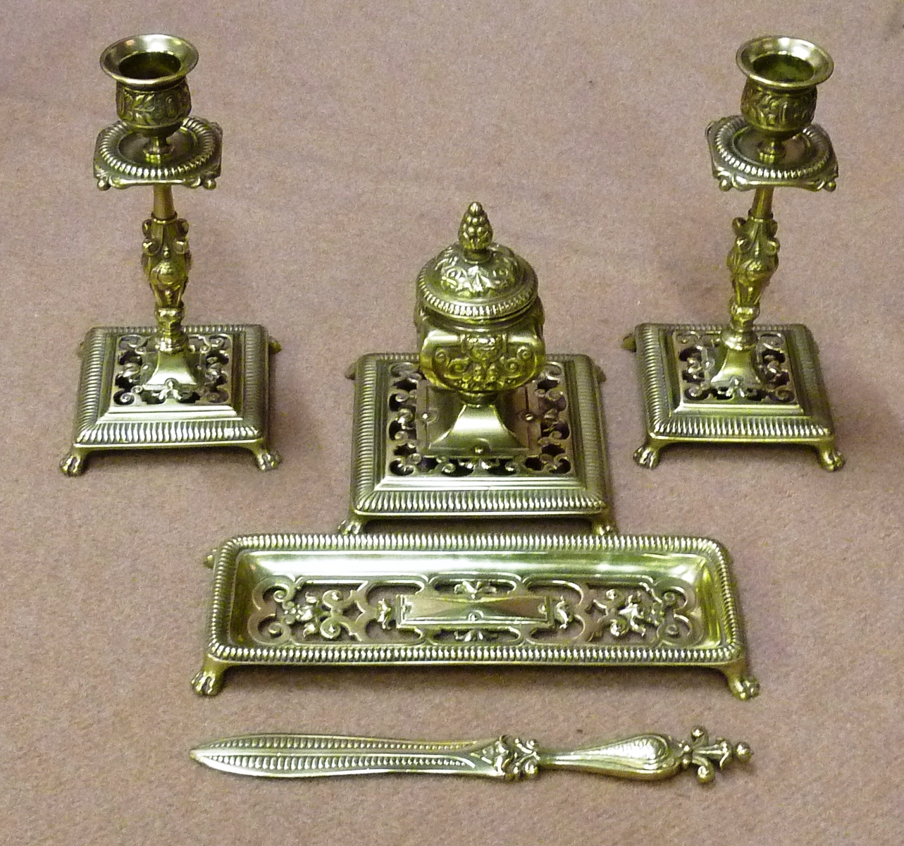 An unusual late 19th/early 20th Century Desk Set comprising a pair of table Candlesticks, a Pen