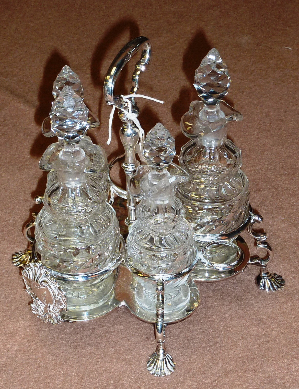 A mid 18th Century hallmarked silver Warwick Cruet on four shell shaped feet, assayed London 1750