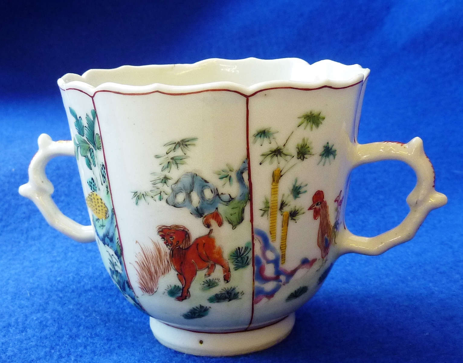 An unusual Chinese porcelain two handled Cup of delicate proportions, six vignettes of animals in