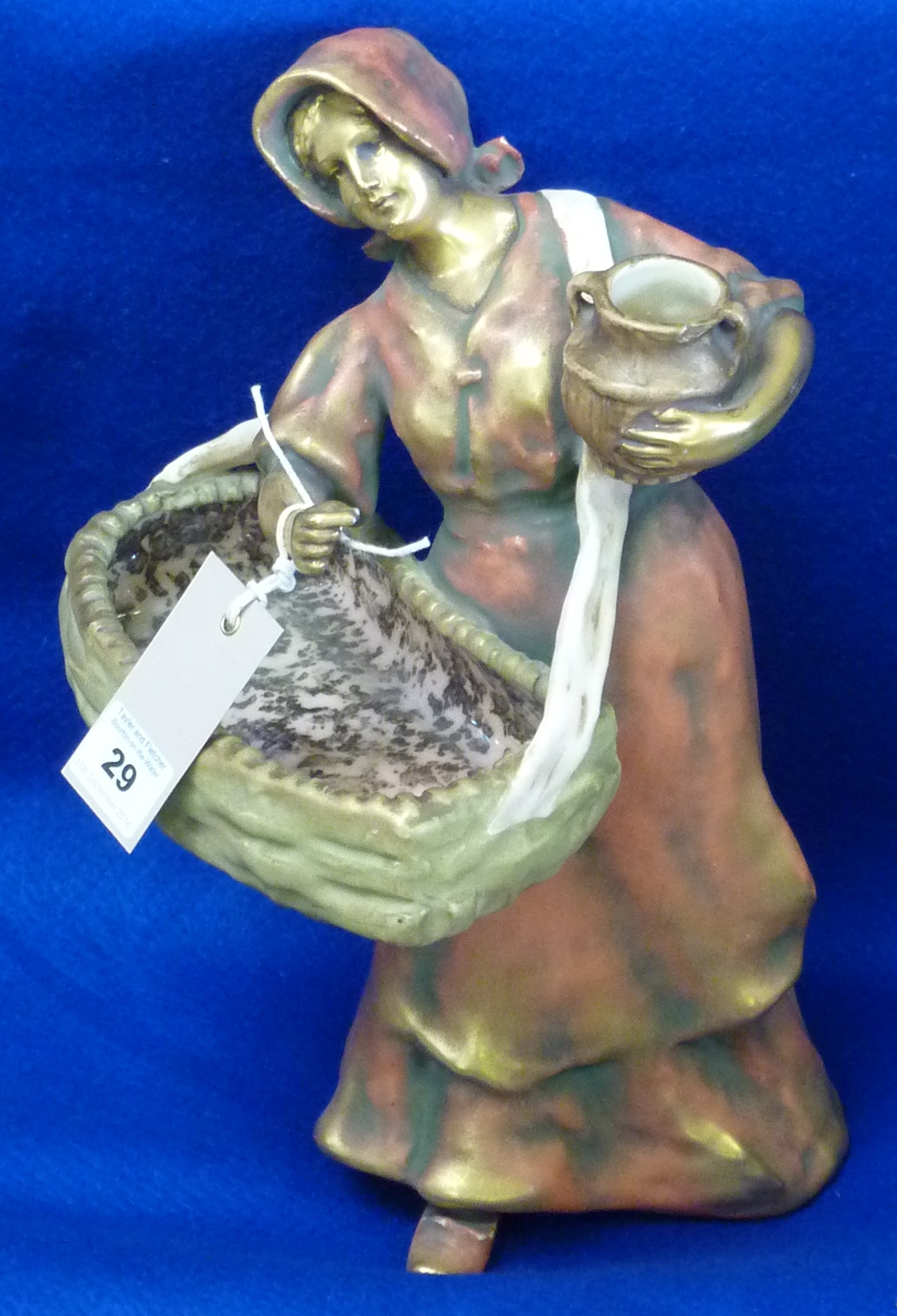 A large Art Nouveau Amphora Figure of a peasant woman with a flower basket, circa 1900 and