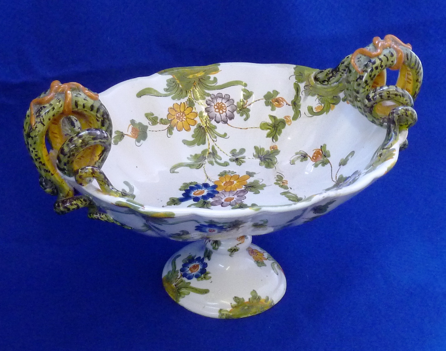 A late 19th/early 20th Century Continental two handled pottery Faience style Comport, the handles