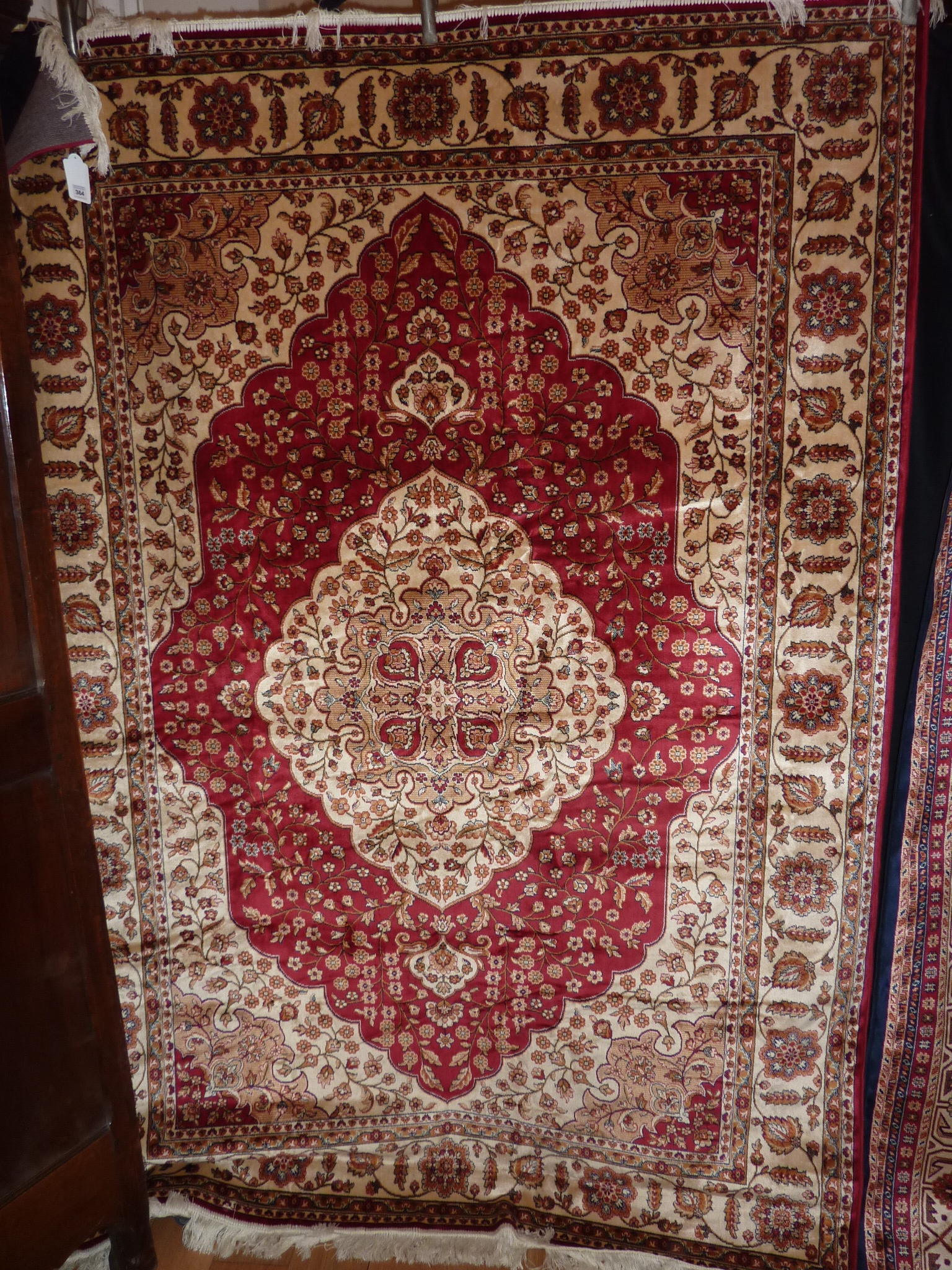 A red ground Kum Carpet, 2.30 x 1.60