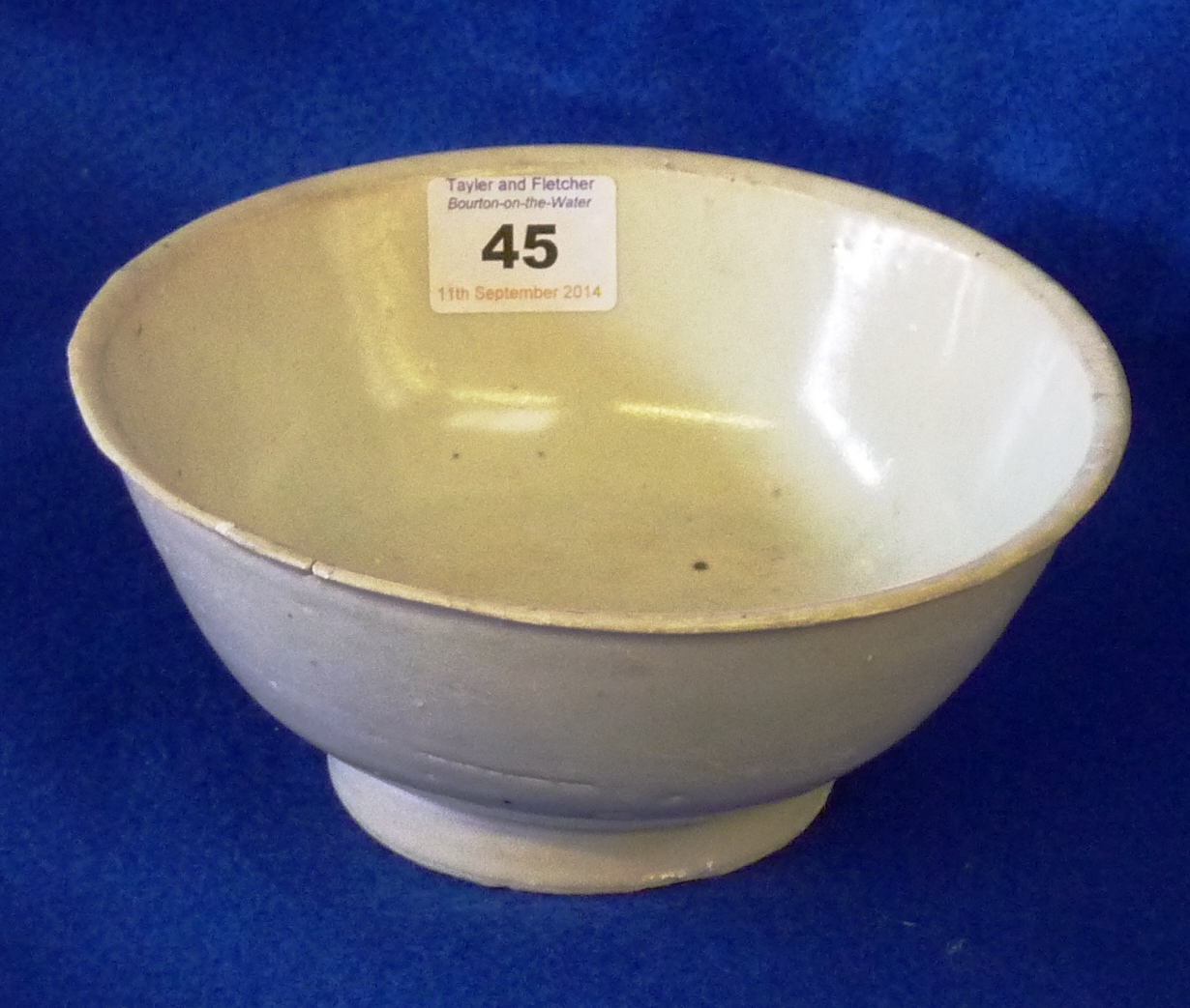 Tek Sing Cargo, a plain Celadon glaze Bowl raised on circular foot, labels to underside, (small