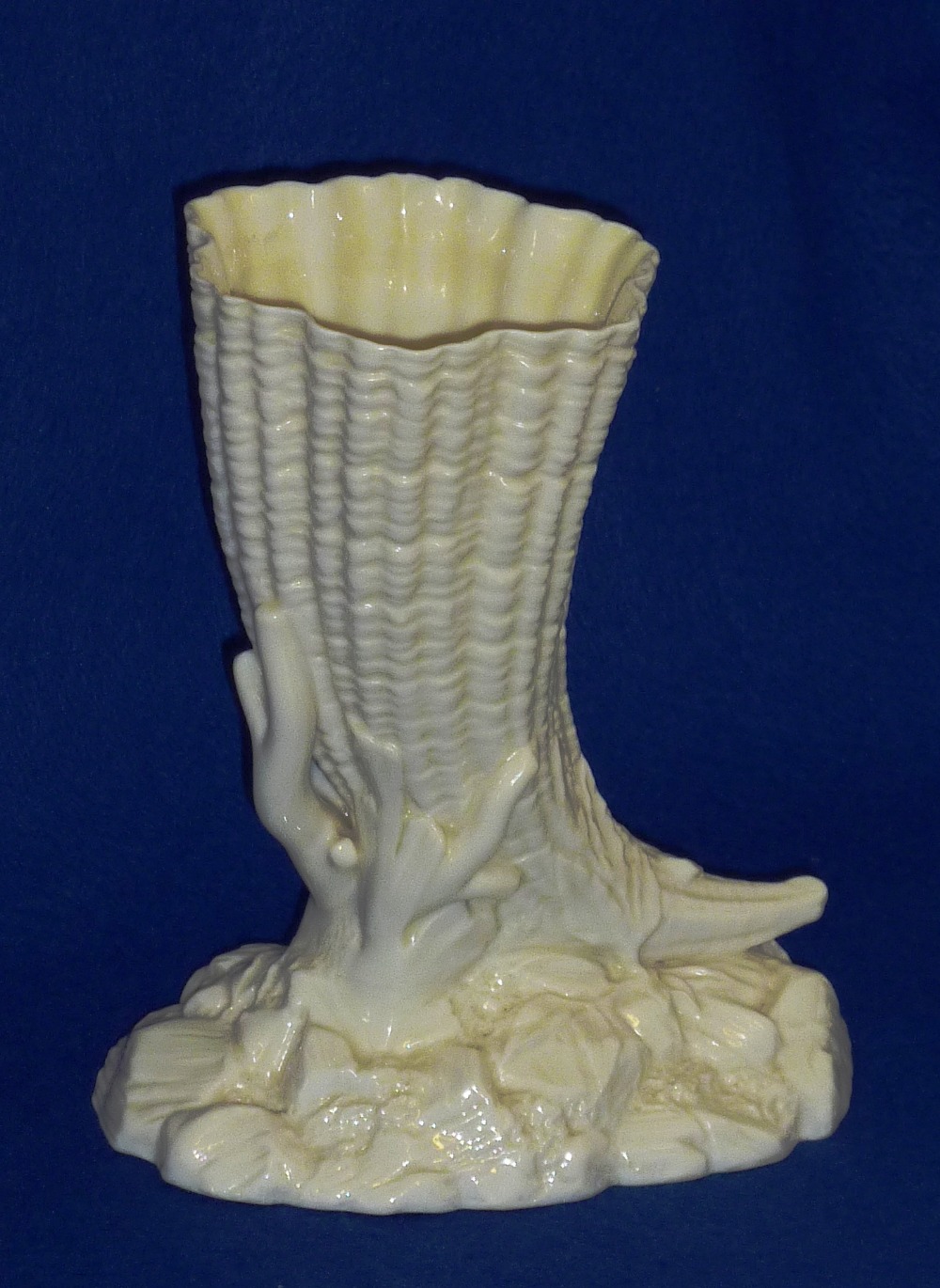 A late 19th Century Royal Worcester white glazed ceramic porcelain Vase modelled as a cornucopia,