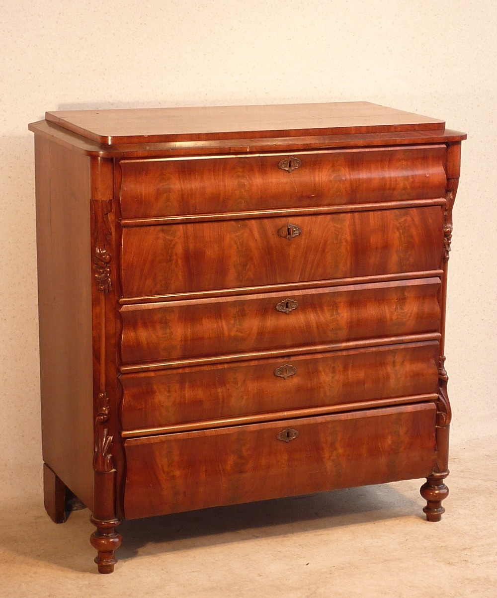 A 19th Century Continental flame mahogany veneered Chest, the quarter veneered top above four full