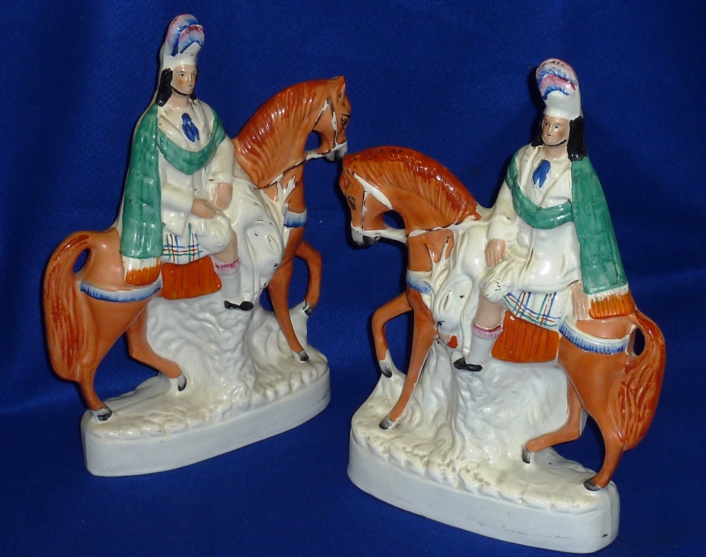 A pair of large 19th Century hand decorated Staffordshire Pottery flat back Models of mounted