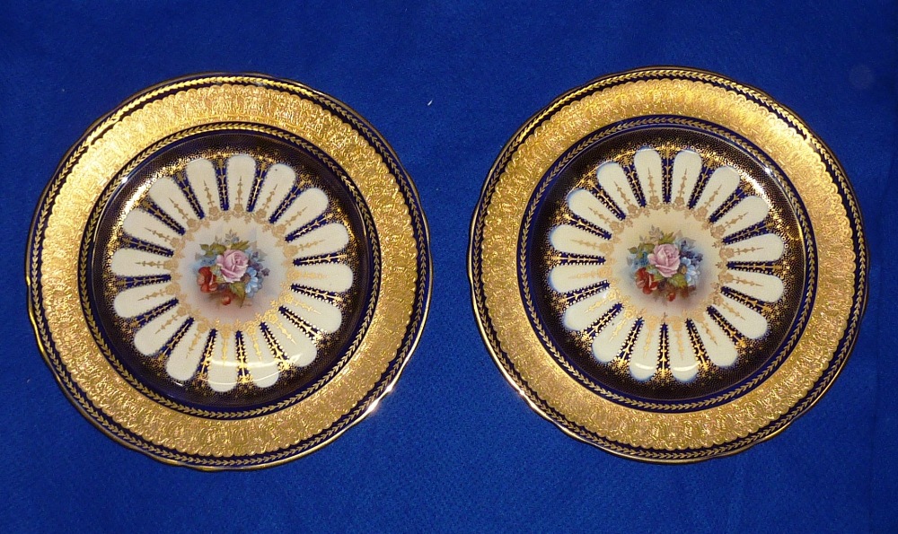 A pair of fine quality Aynsley Porcelain fine bone china Cabinet Plates, each with hand gilded