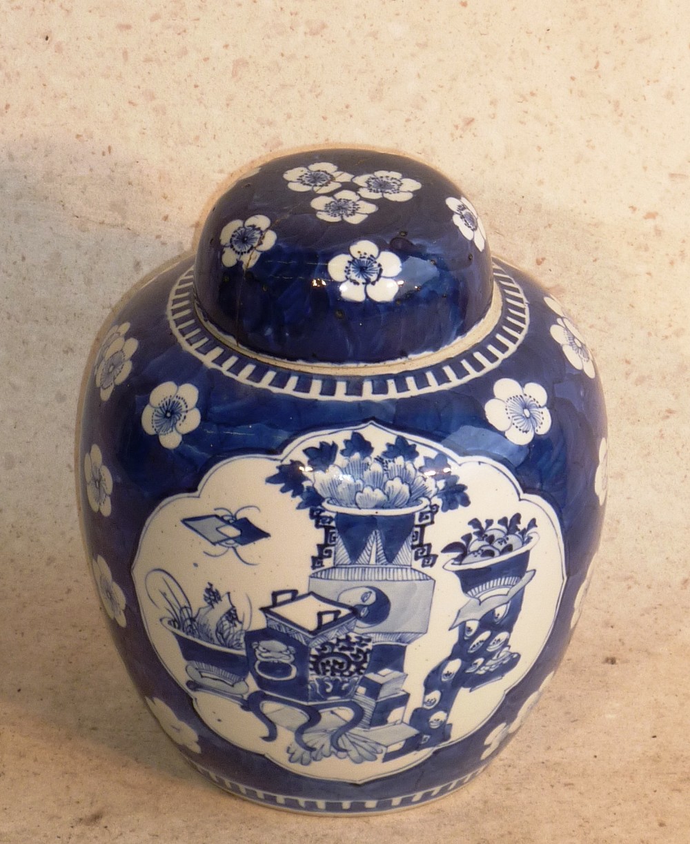 A Chinese Kangxi style porcelain Ginger Jar and Cover, the body with prunus blossom against a