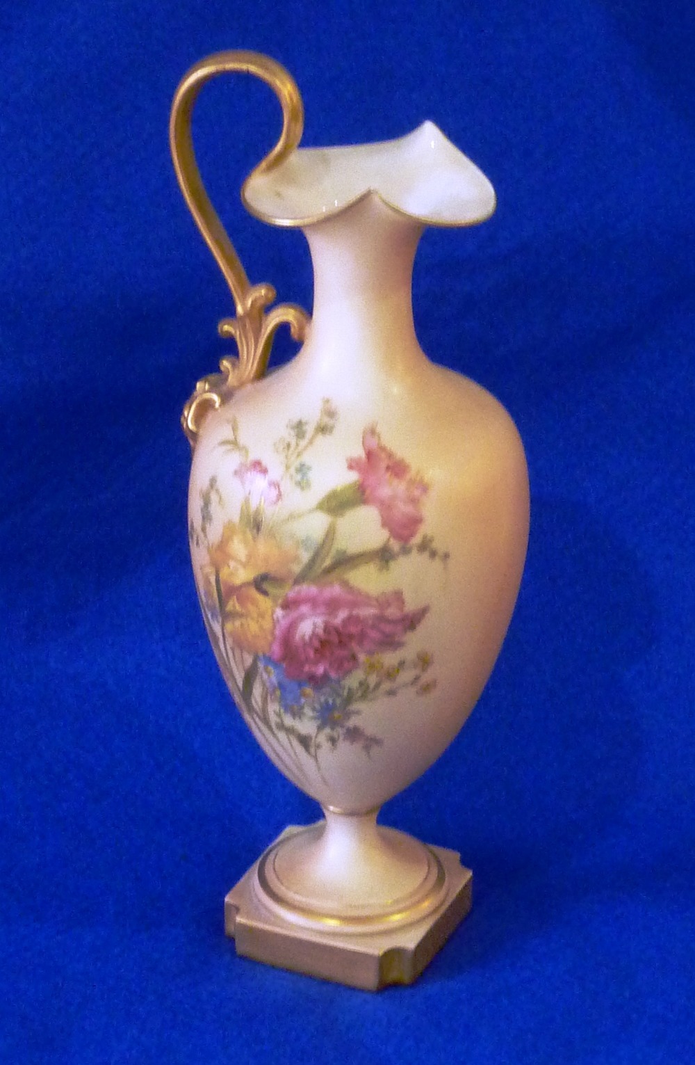 An Edwardian period Royal Worcester blush porcelain Ewer, hand gilded and decorated in enamels