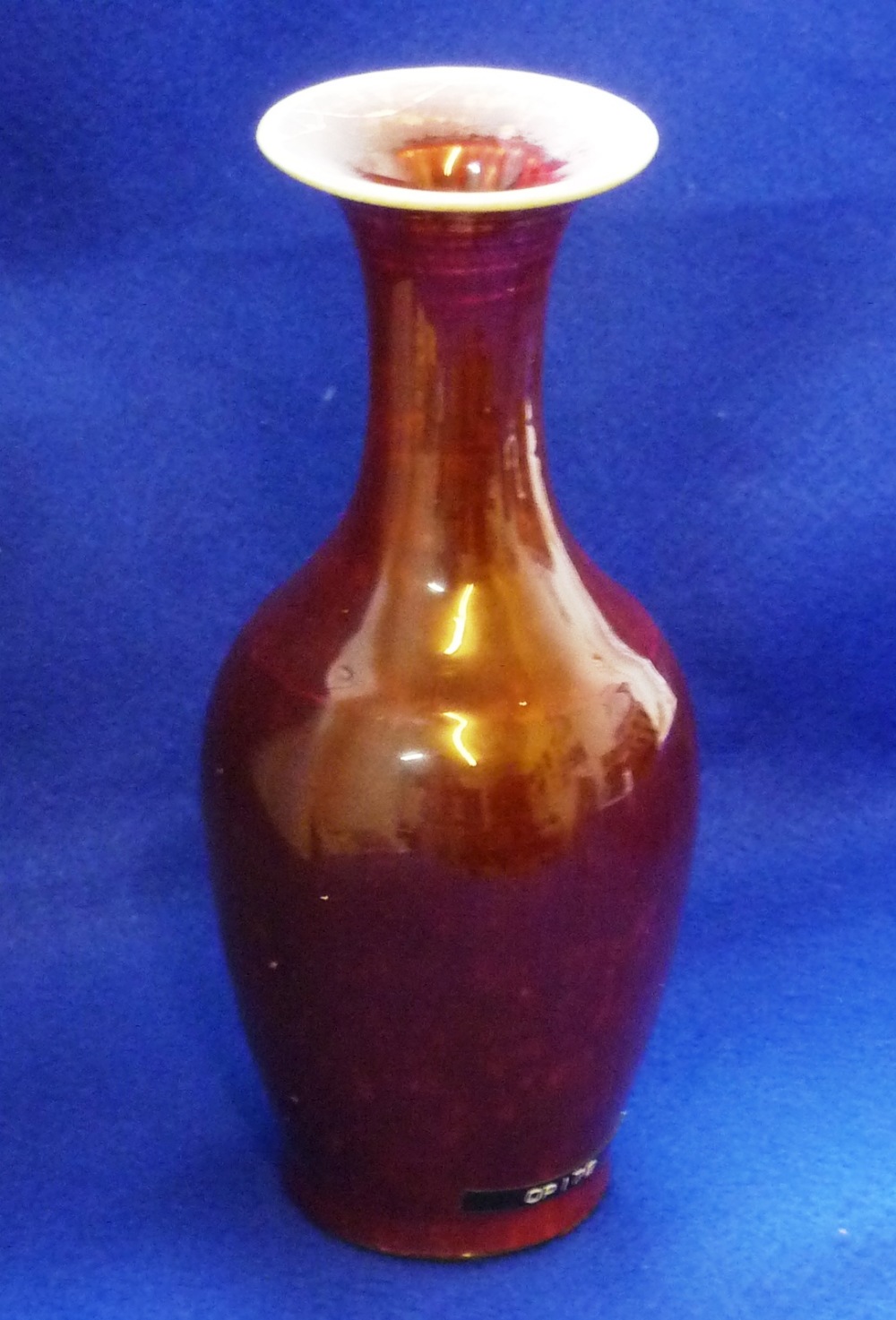 A Chinese porcelain mallet shaped Vase having deep sang de beouf glaze, waisted neck above