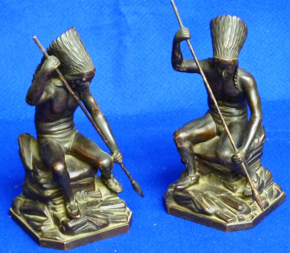 A pair of early 20th Century bronzed copper alloy Book Ends modelled as seated native American