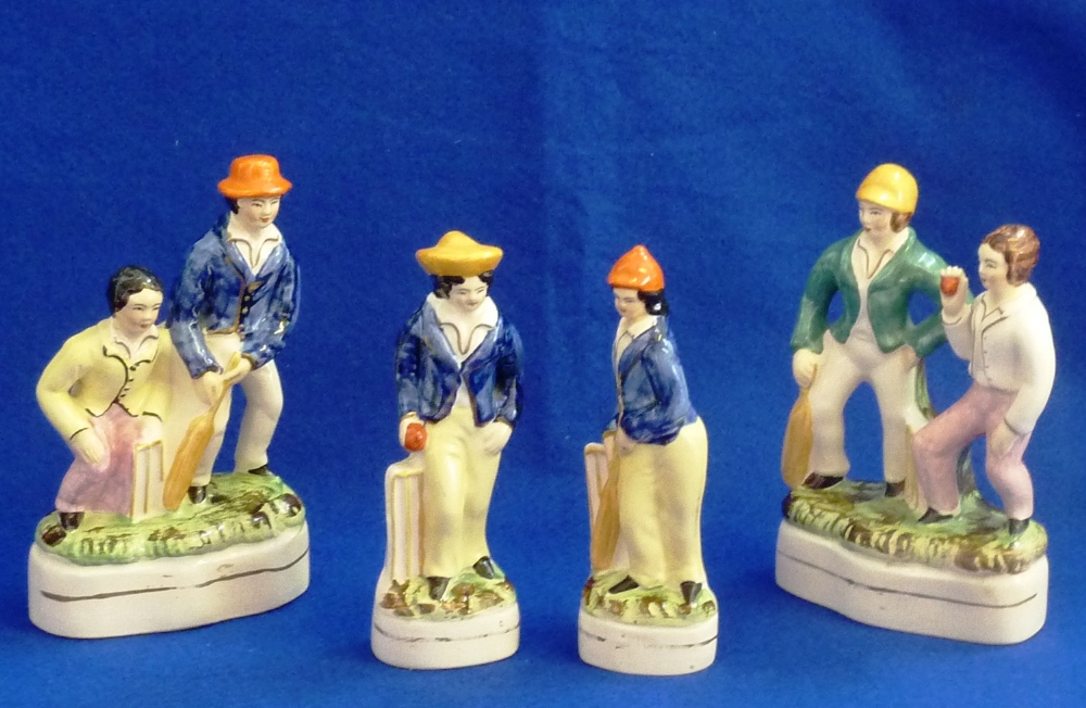 A pair of 19th Century hand decorated Staffordshire Pottery Figures of Cricketers (one with bat by