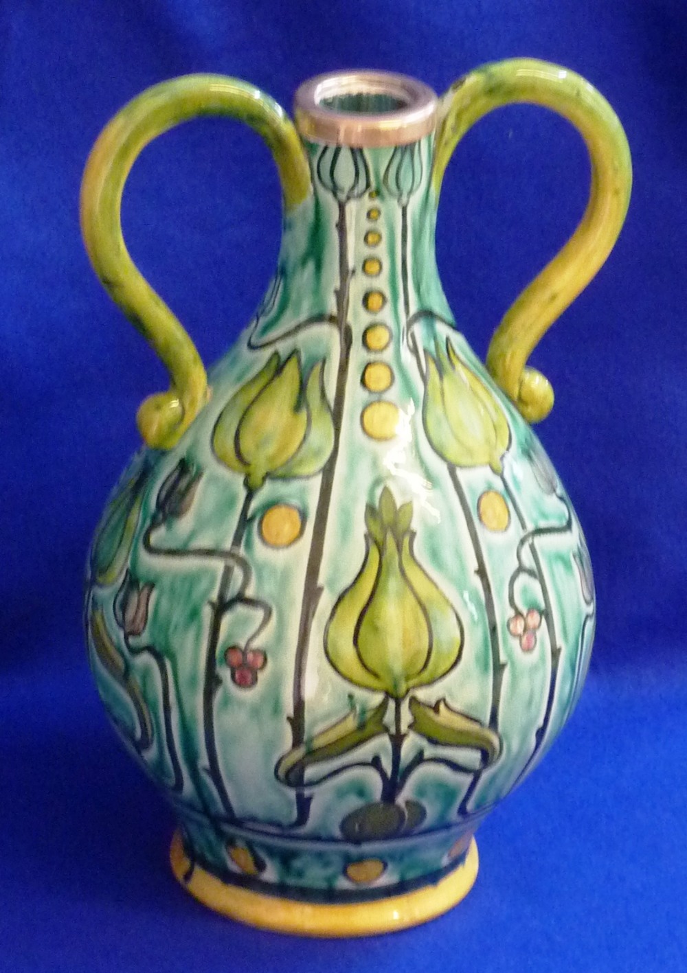 A late 19th/early 20th Century Della Robbia pottery Vase, the white metal neck collar flanked by two