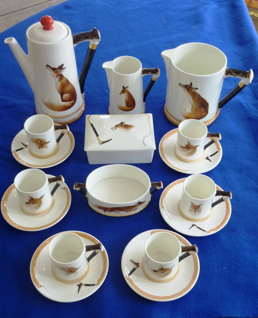 A good early 20th Century composition Royal Doulton Coffee Service, "Reynard Fox" (Registered No.