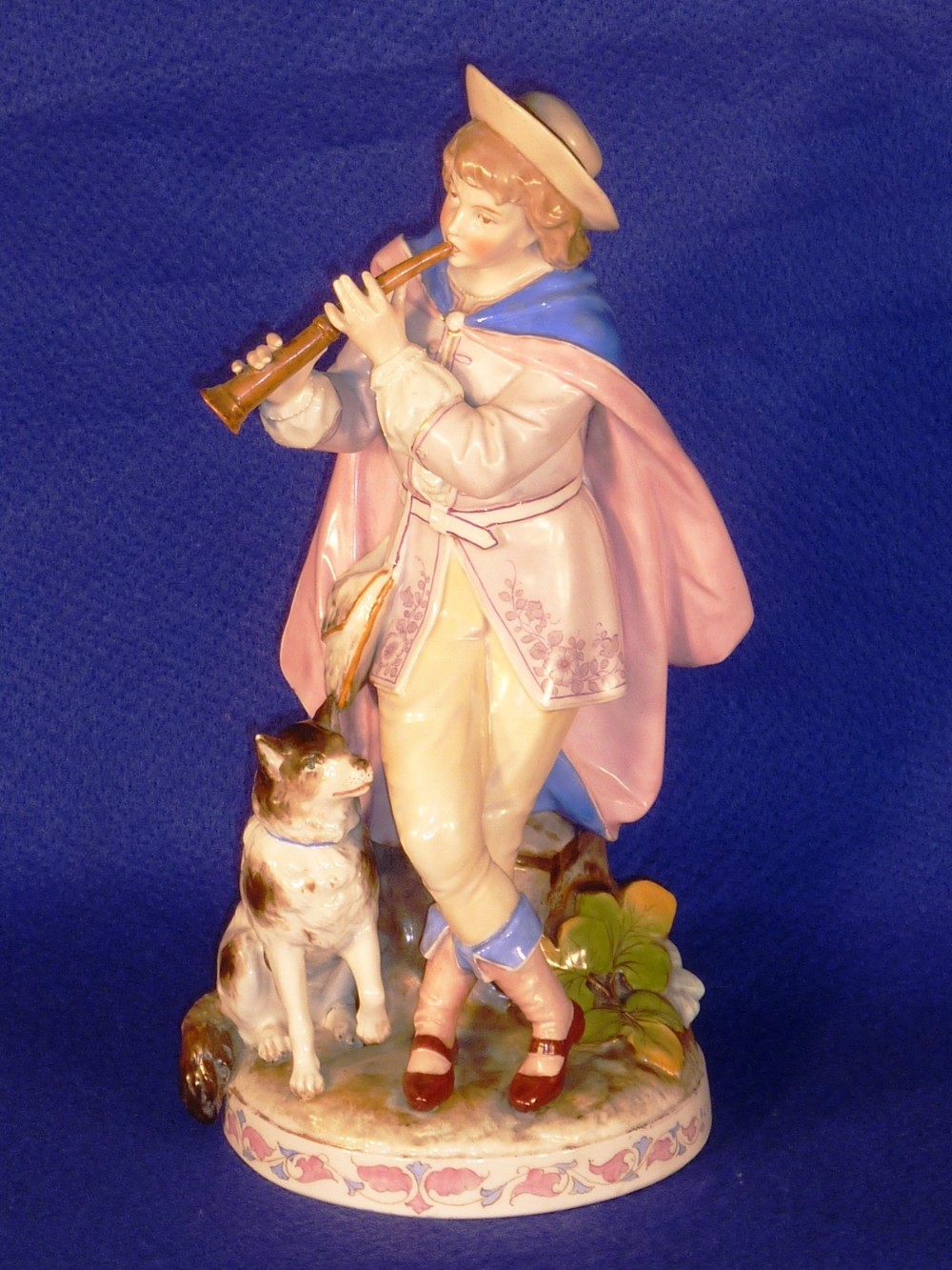 A 19th Century Continental hand decorated porcelain Spill Vase modelled as a young boy in hat and