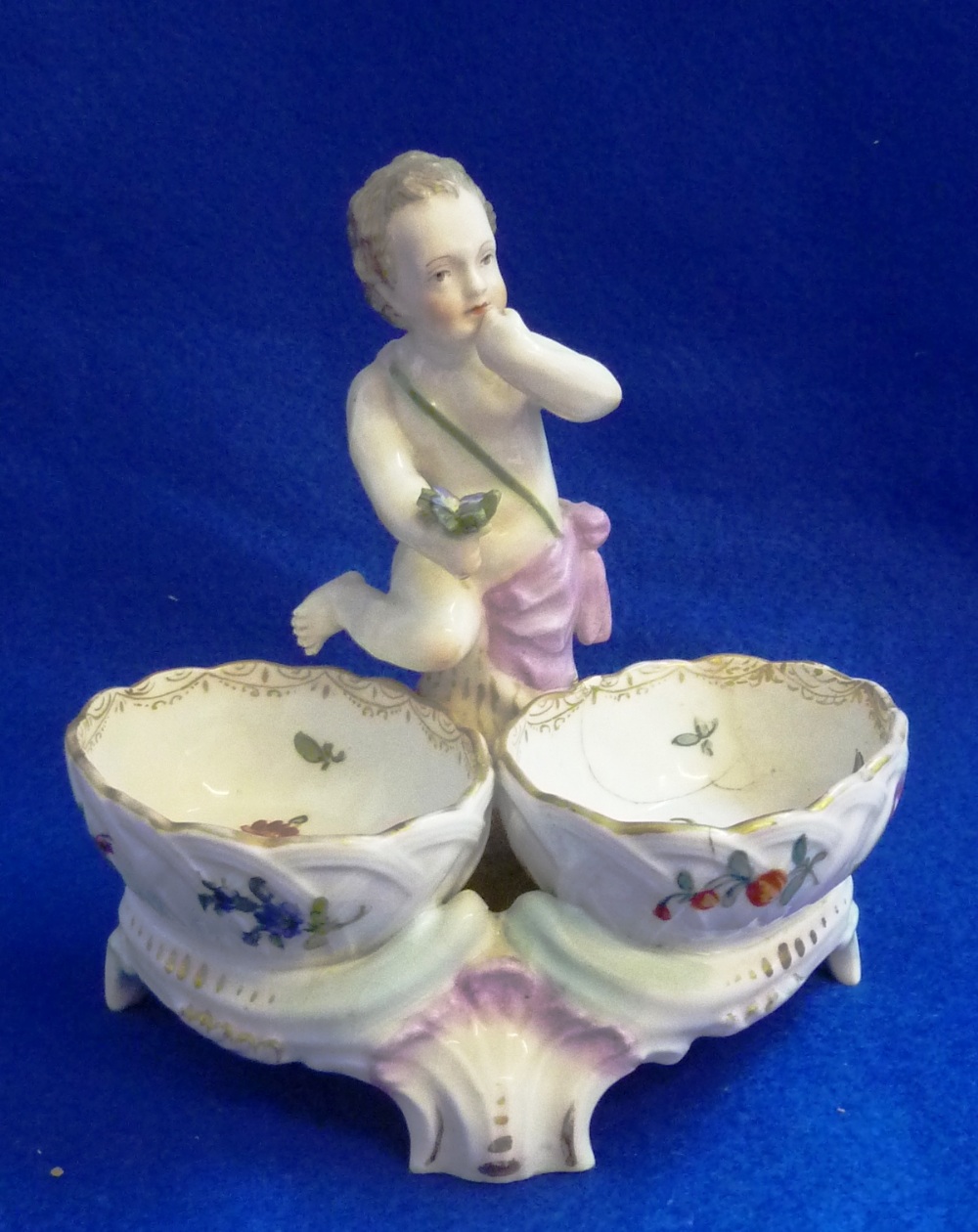 A 19th Century Continental porcelain (probably Meissen) two division Table Salt, cherubic figure