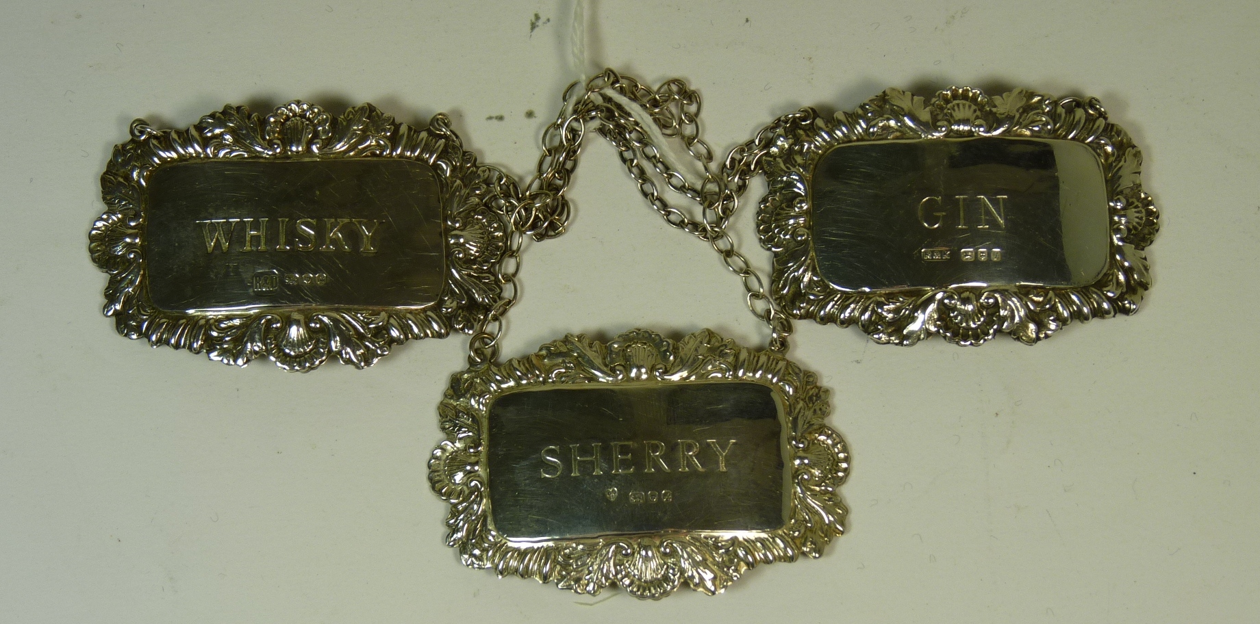 Three Georgian style silver decanter labels ""Sherry"" ""Whisky"" and ""Gin""  1.13oz (3)