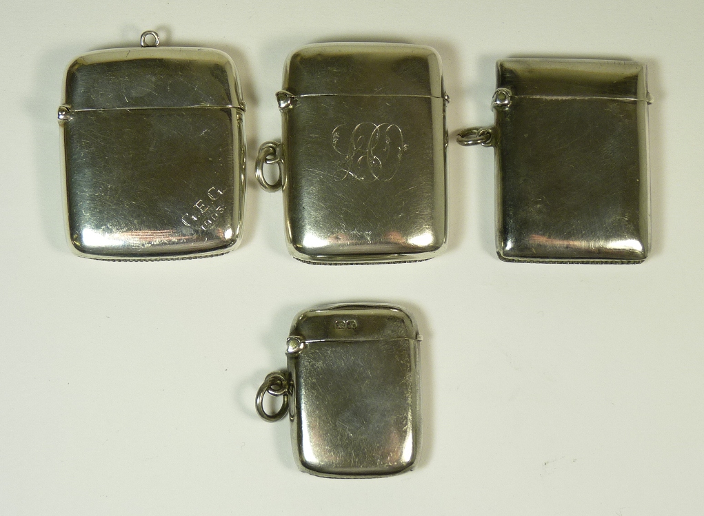 Four silver vesta cases, two engraved with initials, various sizes and dates, total 2.8oz (4)