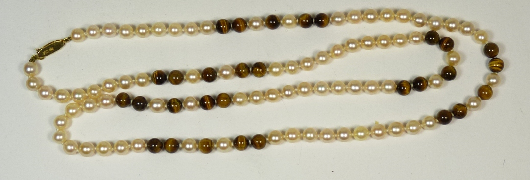 A cultured pearl and tigers eye bead necklace with 9ct gold clasp, total length 72cms