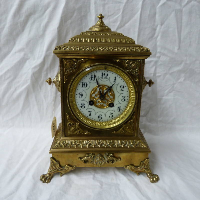 LATE 19TH CENTURY BRASS CLOCK WITH CIRCULAR WHITE DIAL, 30CM