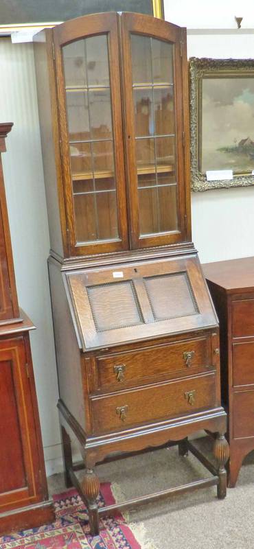 EARLY 20TH CENTURY OAK BUREAU BOOKCASE WITH 2 ASTRAGAL GLASS DOORS OVER FALL FRONT WITH FITTER