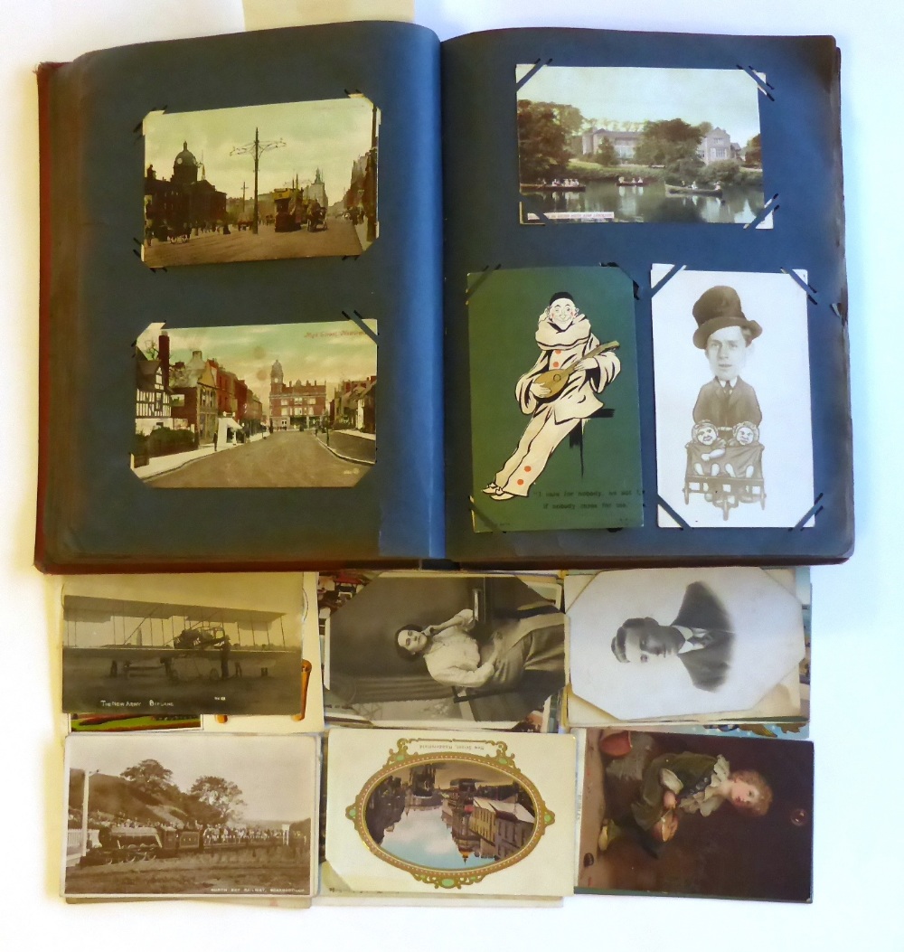 An Album of Mixed Postcards, containing approximately two hundred and fifty pre war cards,