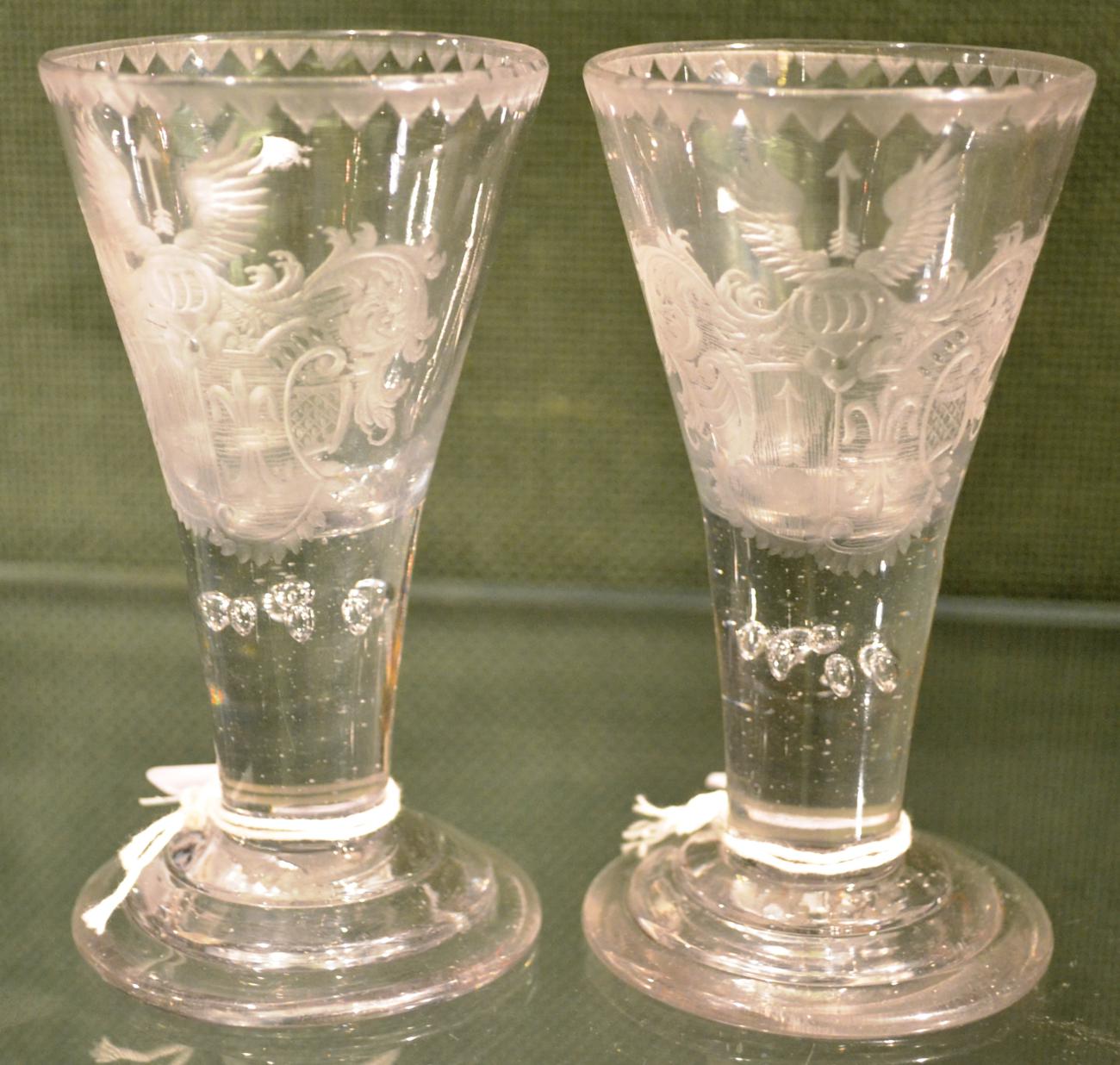 A Pair of Wine Glasses, mid 18th century, the conical bowls engraved with armorials, on tapering