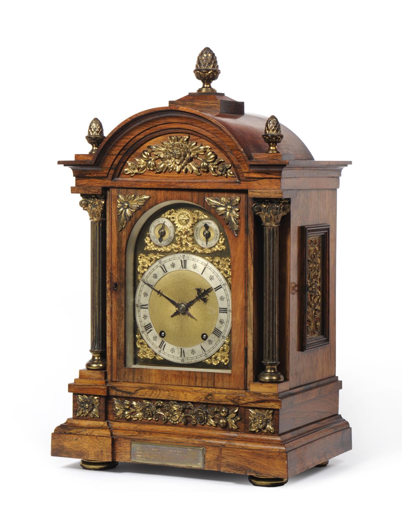 An Oak Chiming Table Clock, retailed by West & Son, Dublin, circa 1890, arched top with acorn