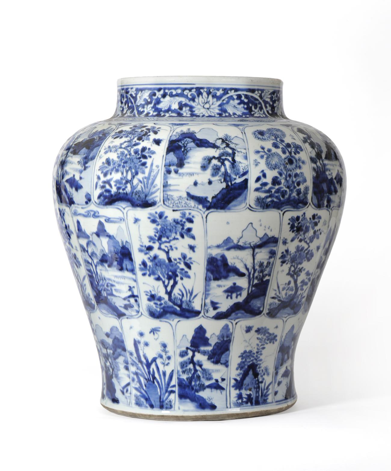 A Chinese Porcelain Baluster Jar, Kangxi period, painted in underglaze blue with flowering trees