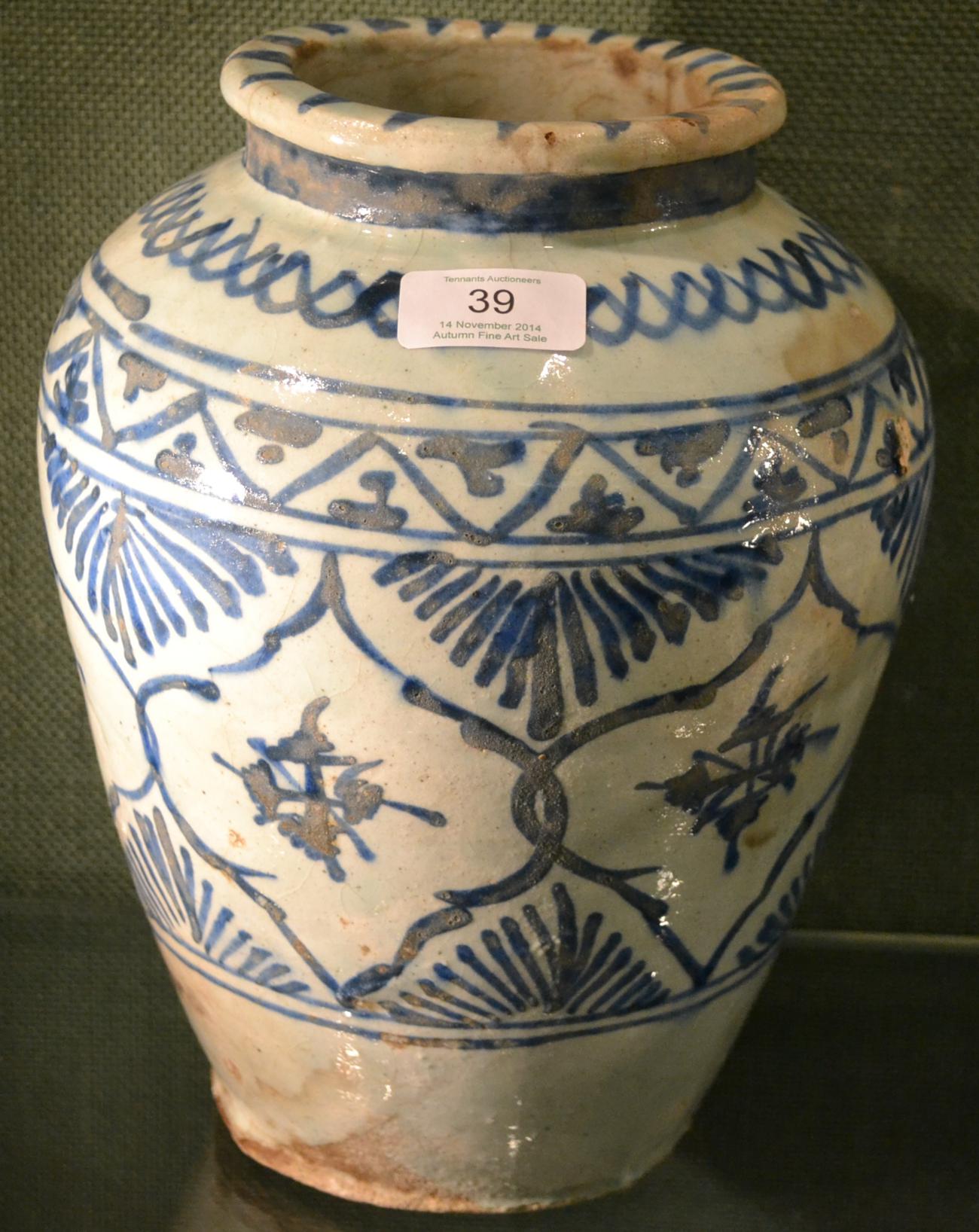 A Persian Faience Jar, probably 17th century, of baluster form with flared neck, painted in blue