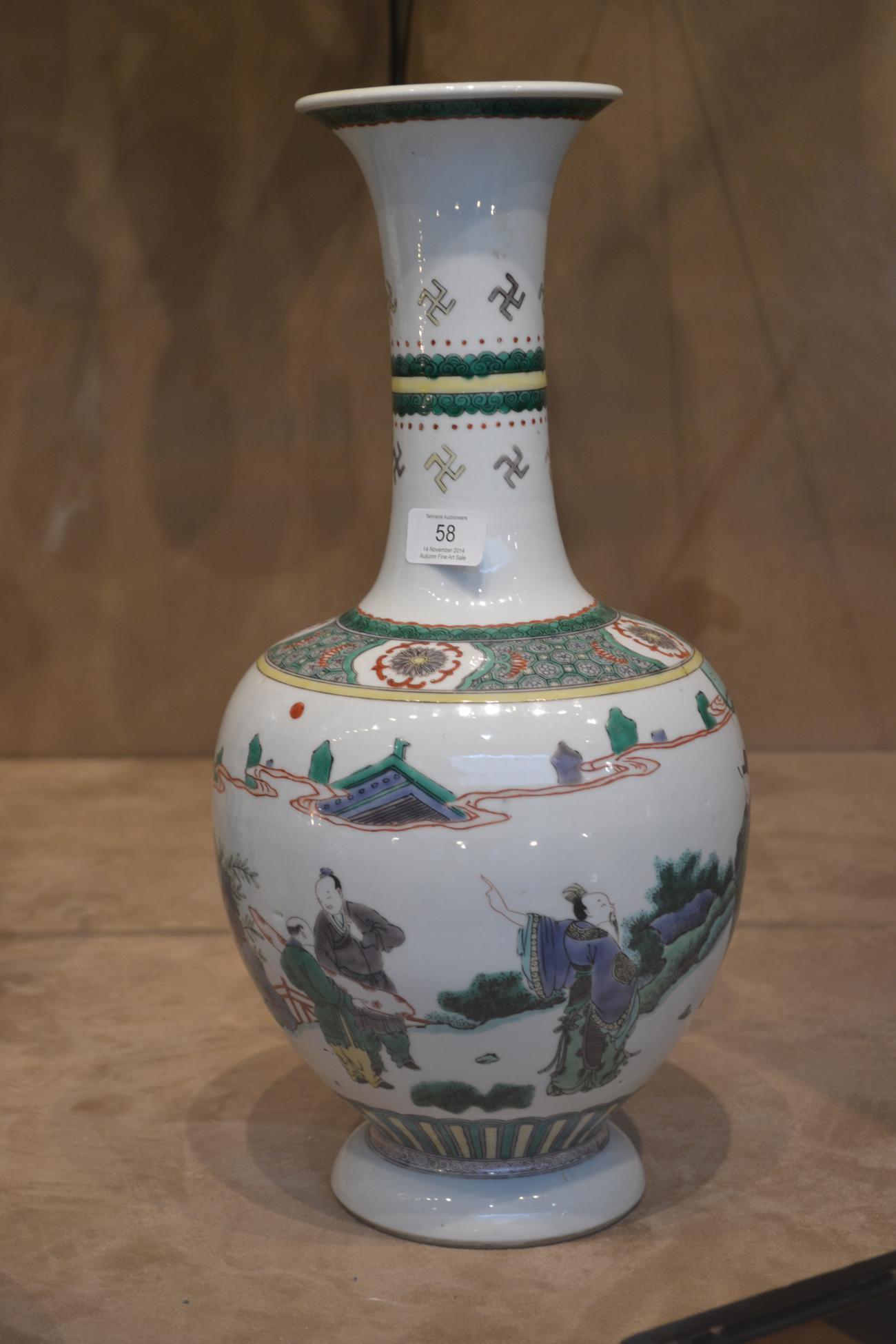 A Chinese Porcelain Bottle Vase, 19th century, painted in famille verte enamels with a dignitary