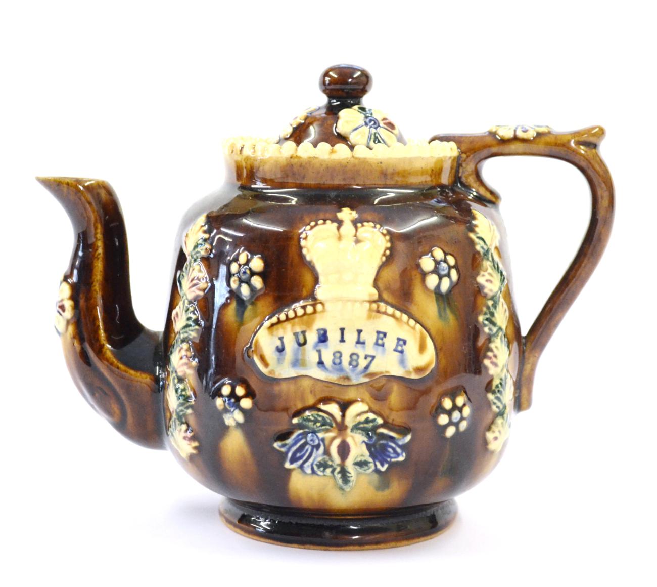 A Measham Bargeware Golden Jubilee Commemorative Teapot and Cover, dated 1887, of ovoid form,