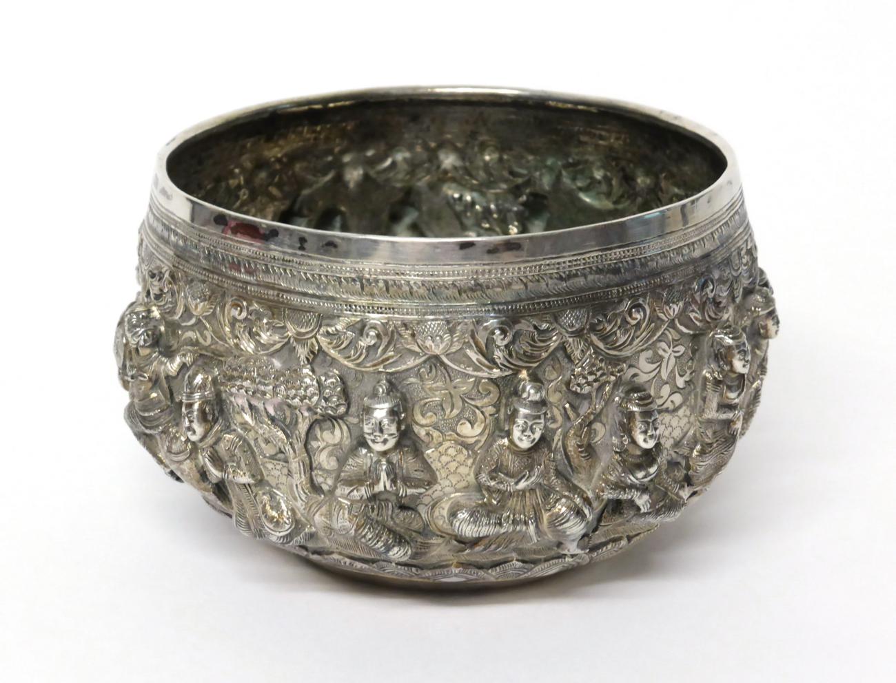 An Indian White Metal Bowl, circular, profusely chased with fourteen deities and Gods including