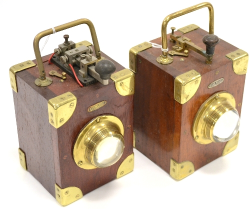 Ever Ready A Pair Of Signalling Lamps constructed in wood with brass fittings, bullseye lens with